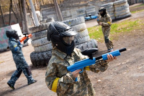 kids playing paint ball on course