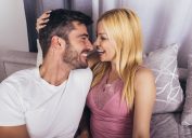 couple embracing in bed brainstorming great nicknames for one another