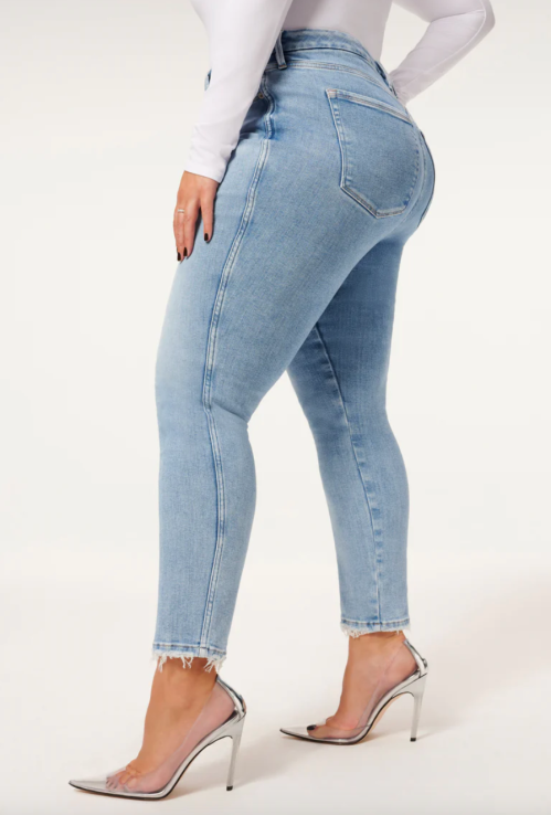 Close up side view of a model wearing Good American's Good Curve Skinny Jeans