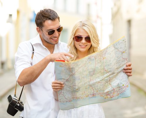couple looking at map while on vacation