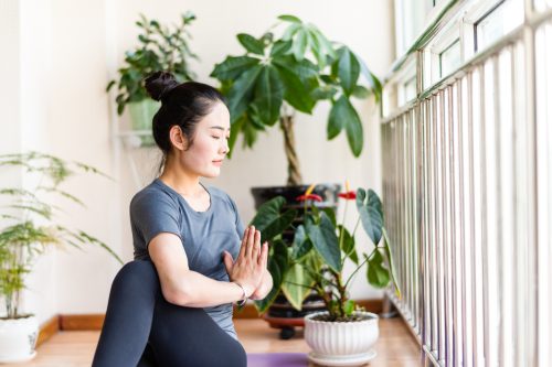 Asian young woman practicing yoga