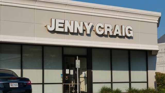 Jenny Craig weight loss clinic building exterior and parking lot in a Houston, TX shopping center.