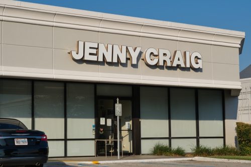 Jenny Craig weight loss clinic building exterior and parking lot in a Houston, TX shopping center.