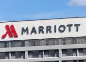 A sign and logo on a Marriott Hotel building