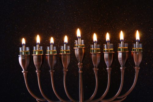 olive oil candles on a hanukkah menorah