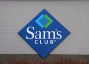 A closeup of a Sam's Club sign on a storefront