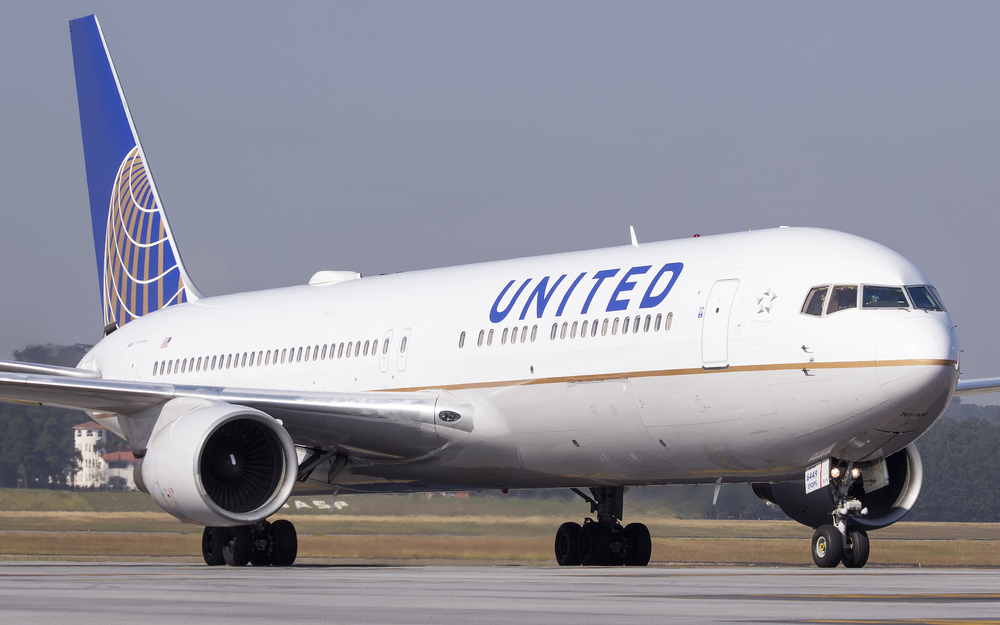 A United Airlines 767 jet taxiing on the runway