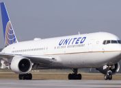 A United Airlines 767 jet taxiing on the runway