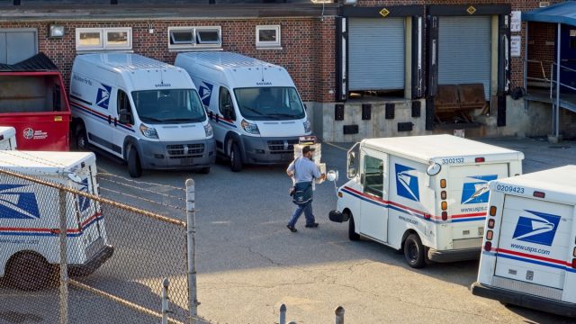 Postal vehicles parked in post office lot at Haverhill Massachusetts