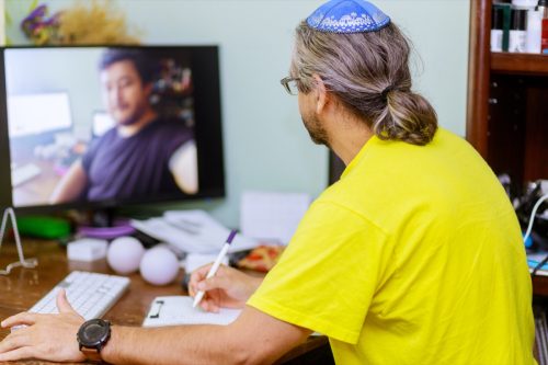 jewish man with yamaka on a zoom conference call