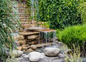 A small decorative waterfall in the garden. Landscape design feng shui