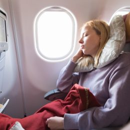 Blonde Girl Sleeping on the Plane
