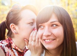 Girl Whispering a Secret