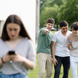 Group of Boys Laughing at a Girl