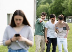 Group of Boys Laughing at a Girl