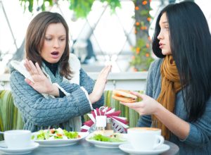 One Woman Refusing to Try a Sandwich