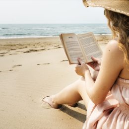 Woman Reading on the Beach