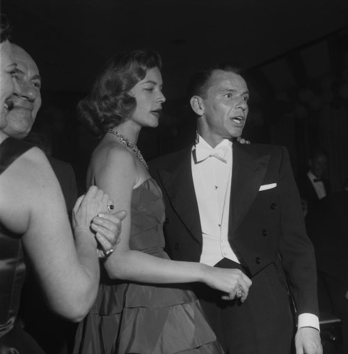 Lauren Bacall and Frank Sinatra at the after party for the 1955 Oscars