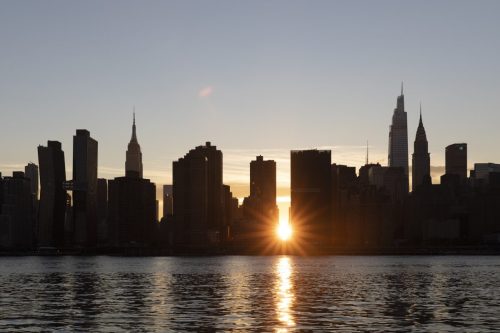 Sunset between the skyscrapers in Manhattan, New York City.