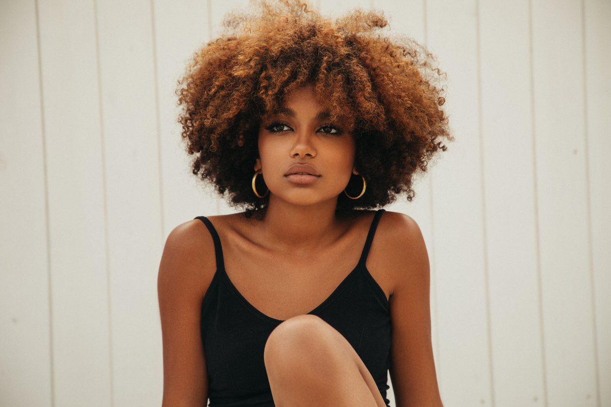 young black woman wearing hoops