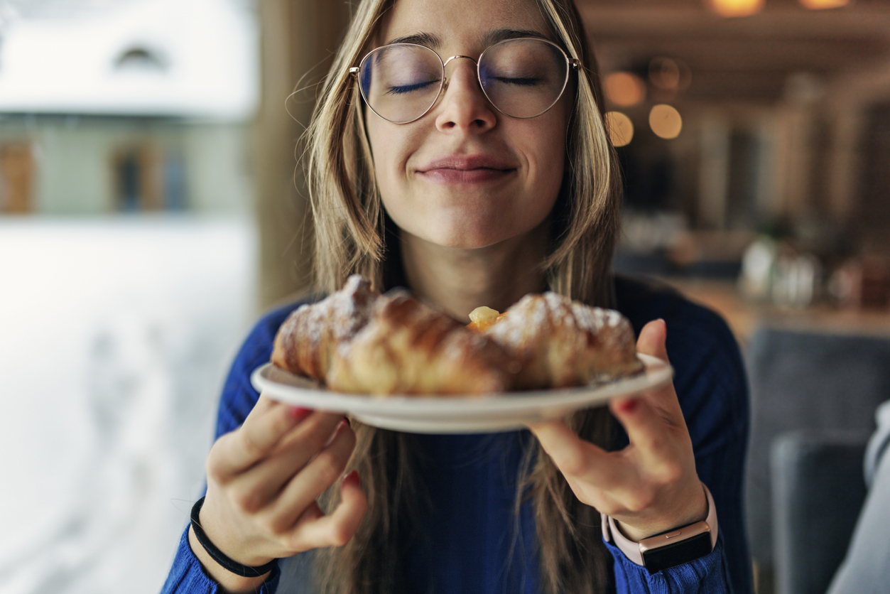 woman eating pastry