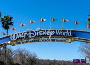 A Walt Disney World arch gate on the road in Orlando, Florida, USA.