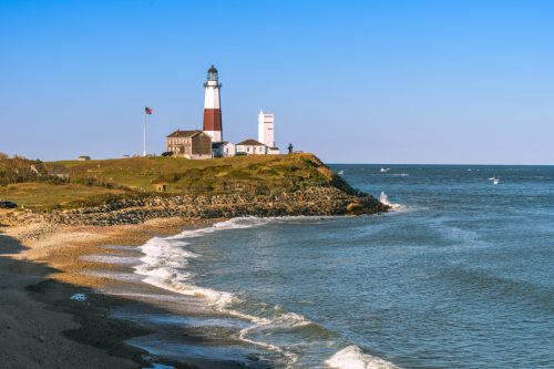 Montauk Point Lighthouse and beach from the cliffs of Camp Hero. Long Island, New York