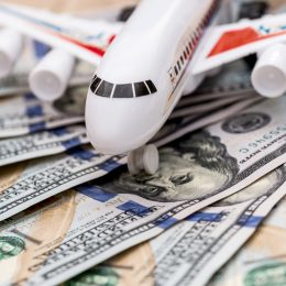 airplane on dollar bills close up