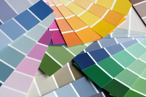A stack of paint color swatches
