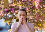 woman sneezing from allergies