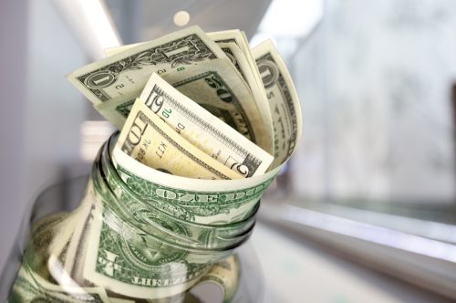 tip jar with cash