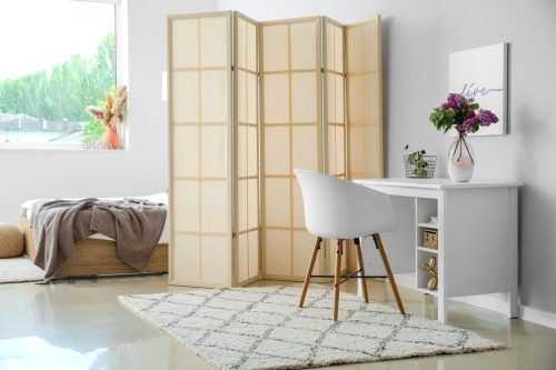 Bright, sunny office and bedroom with room divider