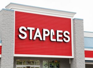 A Staples sign on its storefront