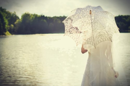 woman with white sun umbrella
