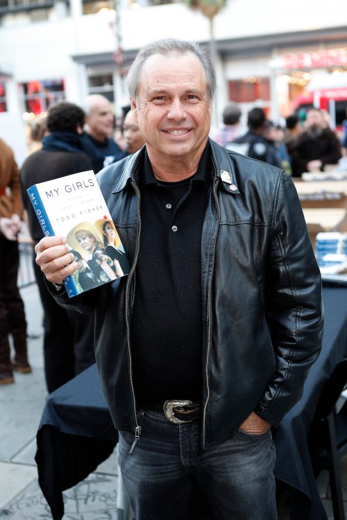 Todd Fisher with his book at opening night celebrations of "Star Wars: The Rise of Skywalker" in 2019