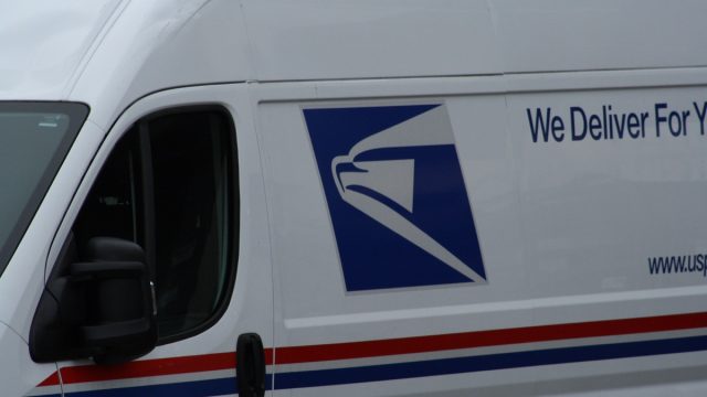 Portland, Oregon / United States – April 26, 2020: United States Postal Service (USPS) mail delivery.