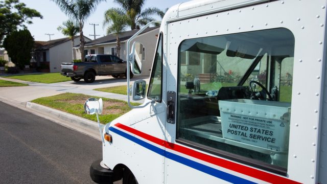Fullerton, California / USA - September 3, 2020: A USPS (United States Parcel Service) mail truck makes a delivery.