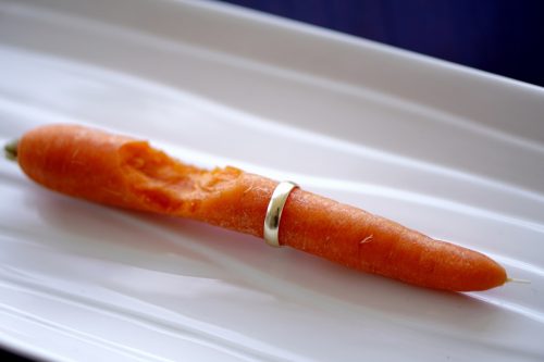 wedding ring on carrot with a bite taken out of it