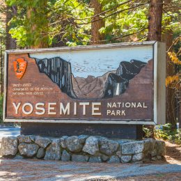 Entrance sign to Yosemite National Park welcoming travelers.