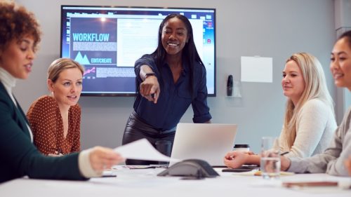 Black Woman Leading a Team Meeting