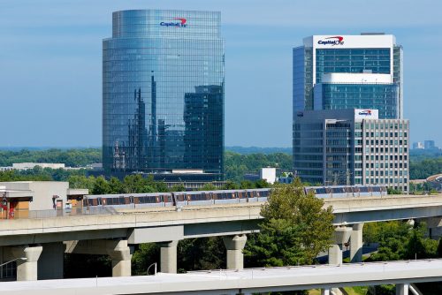 A Metro Silver Line train pulls into McLean Station in front of the Capital One Financial Corporation headquarters buildings in the Tysons Corner area of Fairfax County.