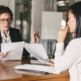 Nervous Young Woman Meeting with Boss