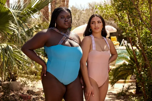 Two models wearing Nomads swimsuits