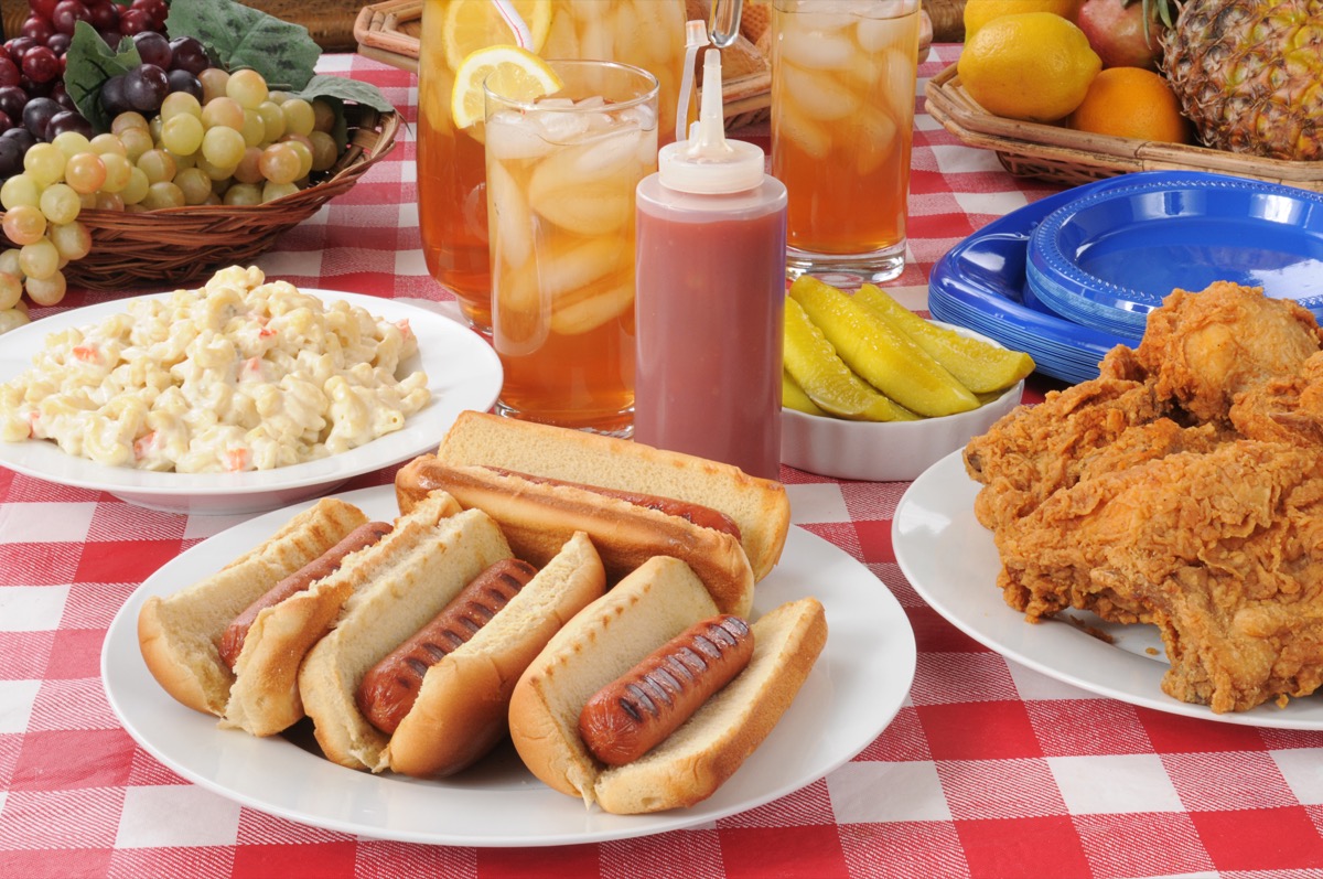 A picnic table loaded with summer foods