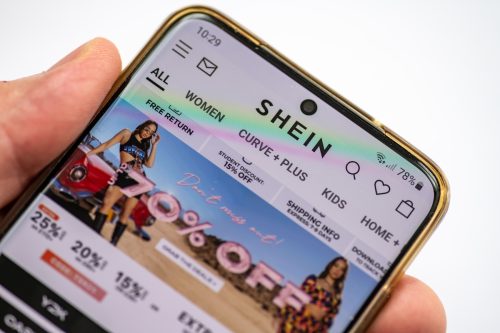 A close up of someone visiting the SHEIN website on their smartphone