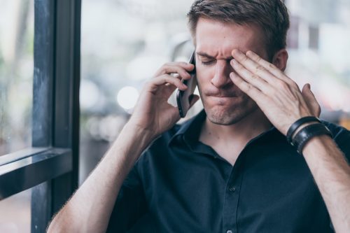 Stressed Man Talking on the Phone