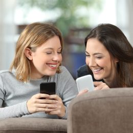 Two Girls Scrolling on Phones