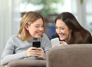 Two Girls Scrolling on Phones