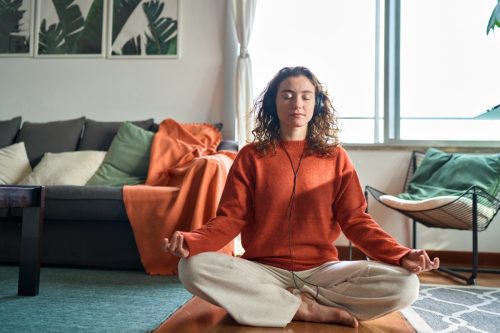 Woman Listening to Music and Meditating