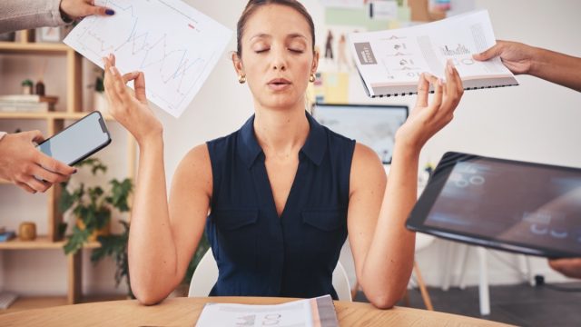 Woman Meditating During Work